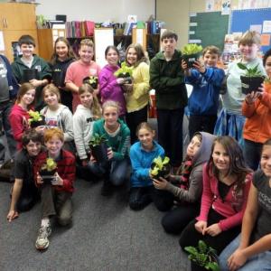 Members of Michelle Miclette's sixth grade class pose with their lettuce and spinach plants. The students were eager to taste their product at lunch November 14. The green house, below, funded by grant money, provides a place for students to learn and grow vegetables. RYAN LEIGHTON/Boothbay Register Members of Michelle Miclette's sixth grade class pose with their lettuce and spinach plants. The students were eager to taste their product at lunch November 14. RYAN LEIGHTON/Boothbay Register