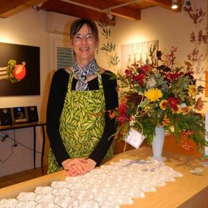 Owner of the Peapod Jewelry Ronna Lugosch prepares for her guests at the Business After Hours event November 1. CHARLOTTE BOYNTON/Wiscasset Newspaper