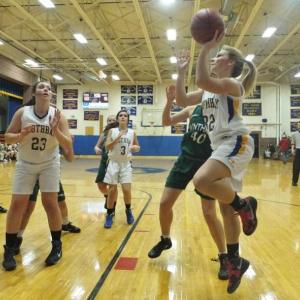 Morgan Crocker gets ready to shoot while cousin Allison Crocker (# 23) and teammate Ashley Reed look on. RYAN LEIGHTON/Boothbay Register Morgan Crocker gets ready to shoot while cousin Allison Crocker (# 23) and teammate Ashley Reed look on. RYAN LEIGHTON/Boothbay Register