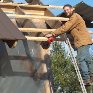 David Stimson builds a roof on his barn on River Road in Boothbay. Stimson said he intends to take his business to Belfast. RYAN LEIGHTON/Boothbay Register David Stimson builds a roof on his barn on River Road in Boothbay. Stimson said he intends to take his business to Belfast. RYAN LEIGHTON/Boothbay Register