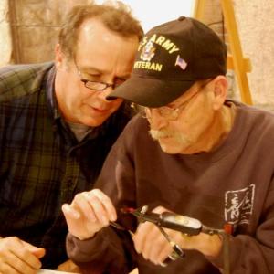 Veterans Camp volunteer Dr. Sean Moran, left, gives tips to a Vietnam veteran during the fly-tying workshop at camp. Courtesy of Joe Tatem Veterans Camp volunteer Dr. Sean Moran, left, gives tips to a Vietnam veteran during the fly-tying workshop at camp. Courtesy of Joe Tatem