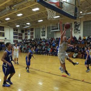 Junior guard Andrew Hallinan powers to the basket against Madison. RYAN LEIGHTON/Boothbay Register