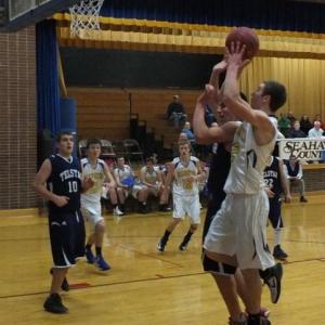 Anthony DiMauro pulls up for a jump shot at home against Telstar January 11. Below: Shawn Simmons drives to the basket. The junior forward scored seven points for Boothbay. RYAN LEIGHTON/Boothbay Register
Anthony DiMauro pulls up for a jump shot at home against Telstar January 11.