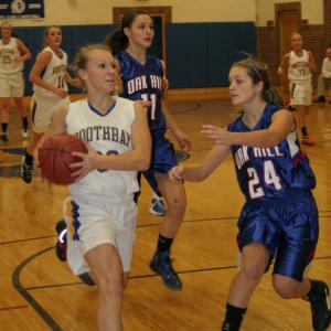 Morgan Crocker drives to the basket against Oak Hill's Danielle Samson. KEVIN BURNHAM/Boothbay Register Morgan Crocker drives to the basket against Oak Hill's Danielle Samson. KEVIN BURNHAM/Boothbay Register