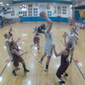 Alex Clarke grabs a rebound over Monmouth during the home opener, December 11. RYAN LEIGHTON/Boothbay Register Alex Clarke grabs a rebound over Monmouth during the home opener, December 11. RYAN LEIGHTON/Boothbay Register