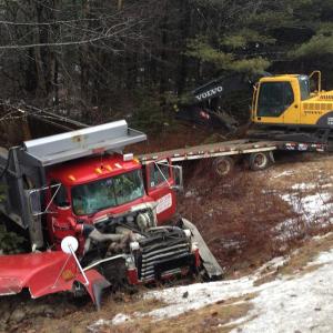 A dump truck driven by William Bailey crashed into an embankment January 30. RYAN LEIGHTON/Boothbay Register
