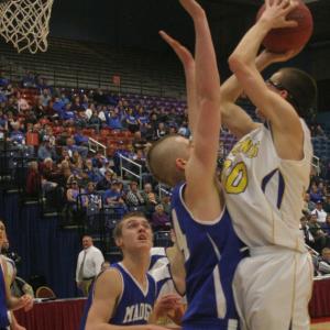 Evan Hepburn shoots over Madison's Steven Lawrence for two points in the second half. KEVIN BURNHAM/Boothbay Register