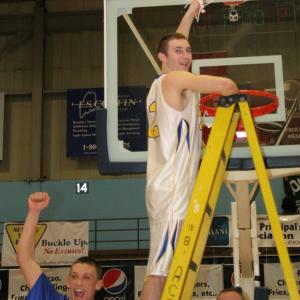 Anthony DiMauro swings the net around and Andrew Hallinan celebrates the victory over Waynflete. KEVIN BURHAM/Boothbay Register