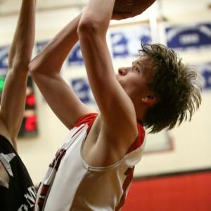 Travis Padilla gets a shot inside in Wiscasset’s win over St. Dom’s in the preliminary round of the Western Maine Class C tournament. Below: Dylan McMahon pulls down a rebound in Wiscasset’s game with St. Dom’s on Wednesday. Courtesy of Brion Controvillas Travis Padilla gets a shot inside in Wiscasset’s win over St. Dom’s in the preliminary round of the Western Maine Class C tournament. Courtesy of Brion Controvillas