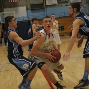 ABOVE: Andrew Hallinan drives to the basket against Dirigo Thursday night at the Augusta Civic Center. MIDDLE: Not backing down, Dirigo's Hunter Ross jumps on John Hepburn's back after Hepburn faked a shot. A foul was called on the play. BOTTOM: Anthony DiMauro works hard to get a shot. KEVIN BURNHAM/Boothbay Register