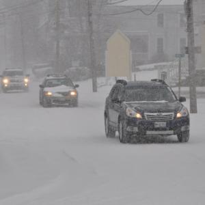 Cars proceed slowly through downtown Boothbay Harbor February 8. BEN BULKELEY/Boothbay Register