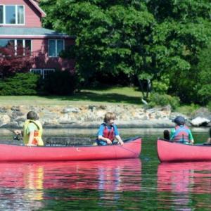 Participants in the Boothbay Region YMCA's half-day fishing camp. Below: One of Camp Knickerbocker's safety drill exercises: learning to swamp a canoe. Courtesy of Earl Brewer Courtesy of Earl Brewer Participants in the Boothbay Region YMCA's half-day fishing camp.