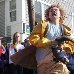 Joey Paollilo helps his team win the Small Fry codfish relay event. SUE MELLO/Boothbay Register