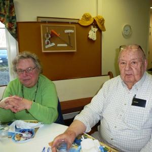 Bawn Clifton, left, and Bill Koutzmann relax after enjoying slices of Pastor Sarah Foulger’s blueberry pie. KATRINA CLARK/Boothbay Register