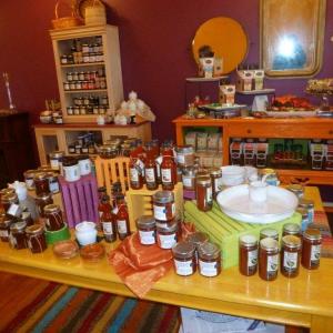 A wide range of jams, hot sauce, relish and serving dishes await eager customers. Behind the table is a sideboard showing a range of new chocolates featuring Eventide’s oils and balsamics. KATRINA CLARK/Boothbay Register