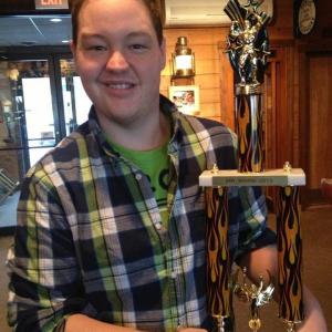 Boothbay native Christopher Holmes with the trophy he won as Mr. Maine March 24. Courtesy Miss Maine Scholarship Program