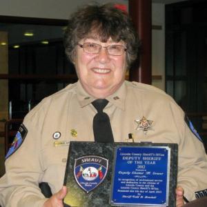 2012 Lincoln County Deputy of the Year, Deputy Eleanor Grover, proudly displays her award. Courtesy of the Lincoln County Sheriff's Office.