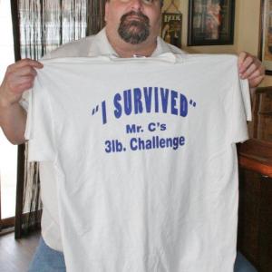Chef Chris Gistis holds the T-shirt that every one of the entrants in the May 4 eating contest will receive. KEVIN BURNHAM/Boothbay Register