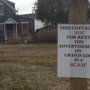 Concerned neighbors put this sign up in front of this Roads End property last week to warn people the rental listing for it on Craigslist is a scam. LISA KRISTOFF/Boothbay Register