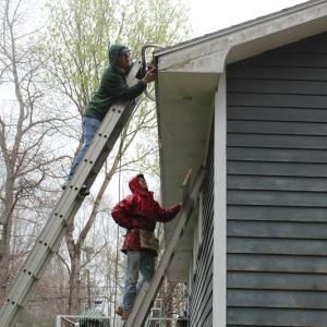 Bill Hamblen and Derek Abbot make repairs at a house on King Phillips Trail. SUE MELLO/Boothbay Register