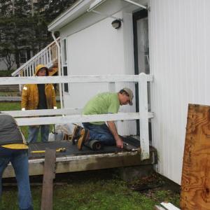 Dean Domeyer, Tiger and Peanut fixing a ramp at the Boothbay Green. SUE MELLO/Boothbay Register
