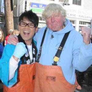 Daisuke Miyagawa and East Boothbay's Rusty Court, the Japanese TV star's guide to Fishermen's Festival. KEVIN BURNHAM/Boothbay Register Below: Daisuke Miyagawa celebrates after downing his second lobster. BEN BULKELEY/Boothbay Register Daisuke Miyagawa and East Boothbay's Rusty Court, the Japanese TV star's guide to Fishermen's Festival. KEVIN BURNHAM/Boothbay Register