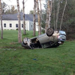 A Toyota Prius driven by Smith Climo, below, rolled over off Route 27 early in the morning of May 14. MIKE MARR/Boothbay Register