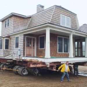 The house formerly owned by George Whitten is propped up on iron beams and hydraulic jacks. Workers from Jewett Builders prepare for the big move. RYAN LEIGHTON/Boothbay Register The house formerly owned by George Whitten is propped up on iron beams and hydraulic jacks. Workers from Jewett Builders prepare for the big move. RYAN LEIGHTON/Boothbay Register