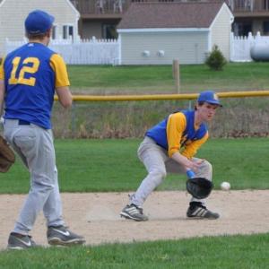 Stephen Barter makes the play on a grounder May 8 against Lisbon. Below: Nate Colcord fires a pitch in the first inning. BEN BULKELEY/Boothbay Register Stephen Barter makes the play on a grounder May 8 against Lisbon. BEN BULKELEY/Boothbay Register