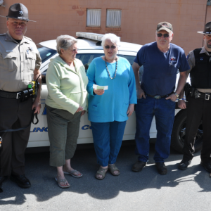 The Rotary Club of Boothbay Harbor presents Katharine Martin-Savage with a check for $1,000 for the Heidi Fund, which is used to purchase new dogs for the Lincoln County Sheriff's Office. From left: Sergeant Alan Shea, Debbie Graves, Katharine Martin-Savage, Daren Graves and Detective Scott Hayden. BEN BULKELEY/Boothbay Register