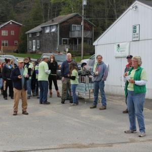 Sally Barter gives initial directions to the crew assembled at the catholic church's parking lot at 7:30 a.m. The high school softball team is pictured at left. SUE MELLO/Boothbay Register