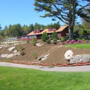 Outside the Boothbay Harbor Country Club clubhouse, landscapers have readied the front apron for plantings. Below: Clubhouse manager Ally Melchreit and assistant pro Raynor Lynn. JOE GELARDEN/Boothbay Register Outside the Boothbay Harbor Country Club clubhouse, landscapers have readied the front apron for plantings. JOE GELARDEN/Boothbay Register