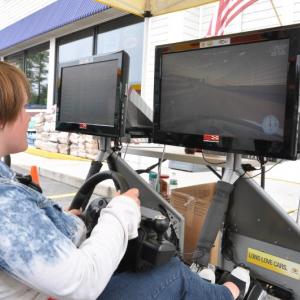 Mariah Mann, 15, tries driving in a NASCAR simulator. BEN BULKELEY/Wiscasset Newspaper 