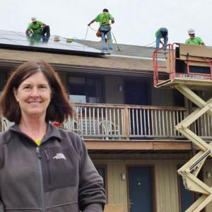 Ann (Robinson) Goggin of Goggin Energy oversees the solar panel installation at Boothbay Harbor's Flagship Inn on June 13. Goggin's solar panels convert direct current from the sun into alternating current right at the solar panel. The panels will offset the Flagship's electricity bill starting July 1. Ann (Robinson) Goggin of Goggin Energy oversees the solar panel installation at Boothbay Harbor's Flagship Inn on June 13. Goggin's solar panels convert direct current from the sun into alternating current right at the solar panel. The panels will offset the Flagship's electricity bill starting July 1.