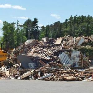 A 200-ton pile of demolition wood sits at the Boothbay Region Refuse Disposal District. The transfer station is having problems getting rid of its wood once it gets grounded up into woodchips. RYAN LEIGHTON/Boothbay Register A 200-ton pile of demolition wood sits at the Boothbay Region Refuse Disposal District. The transfer station is having problems getting rid of its wood once it gets grounded up into woodchips. RYAN LEIGHTON/Boothbay Register