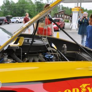 Nathaniel Mann, right, gets a look at the No. 22 Shell/Pennzoil Ford Fusion at Lil' Mart in Wiscasset.