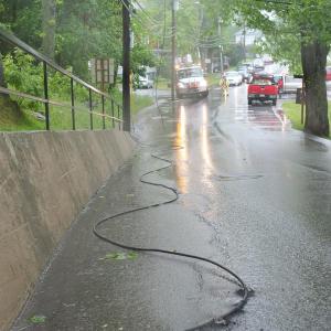 Downed power lines on Oak Street stop traffic, as a Central Maine Power truck arrives at the scene. RYAN LEIGHTON/Boothbay Register