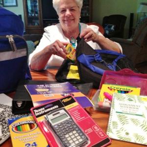 Burge with some of the items in the “Gifts For Learning” for children on the peninsula ages 4 through 12. LISA KRISTOFF/Boothbay Register
