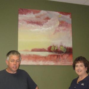 Allen Bunker stands in front of one of his paintings and beside First Federal branch manager Jean Huber. Courtesy of Sandy Terry Allen Bunker stands in front of one of his paintings and beside First Federal branch manager Jean Huber. Courtesy of Sandy Terry
