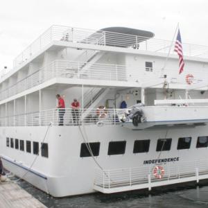 "Independence," an American Cruise Lines ship and frequent visitor to Boothbay Harbor, is tied off by Wotton Wharf’s dock master, Chuck Chaney and Boothbay Region Boatyard’s dock master Amy Armstrong in this September 2012 photo. Independence begins its weekly visits to the harbor this week. LISA KRISTOFF/Boothbay Register