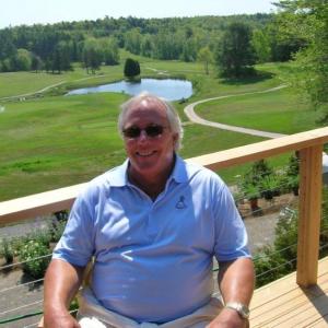 Paul Coulombe sits on the new deck of the clubhouse at the Boothbay Harbor Country Club. JOE GELARDEN/Boothbay Register
