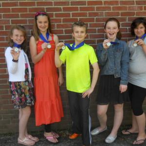 Gold medal winners from left, Ellie Hilscher, Hali Goodwin, Rowan Kristan, Josie Smith and Ciara Pitcher show off their ribbons from the state's Maine in Motion program. Photos courtesy of Rita Arnold