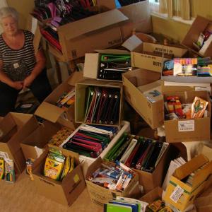 Sue Burge with donations in 2012. SUSAN JOHNS/Boothbay Register. Below: Burge with some of the items in the “Gifts For Learning” for children on the peninsula ages 4 through 12. LISA KRISTOFF/Boothbay Register Sue Burge with donations in 2012. SUSAN JOHNS/Boothbay Register.