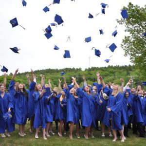 The BRHS Class of 2013 celebrates with the traditional tossing of their caps following the graduation ceremony June 7. BEN BULKELEY/Boothbay Register