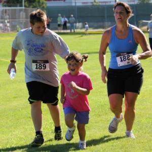Running may not sound fun to some, but this young girl’s face says it all as she approaches the finish line during the kids’ fun run. SUE MELLO/Boothbay Register