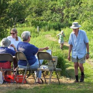 Hungry hikers make their way to the entrance of the German-style grill party held at Penny Lake Preserve. RYAN LEIGHTON/Boothbay Register