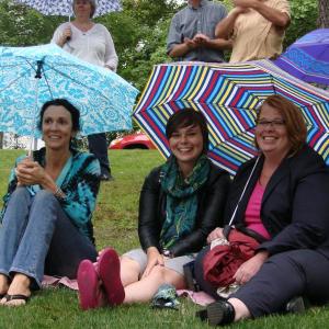 Wiscasset Area Chamber of Commerce board vice chairman Sherri Dunbar, left, Hope Mowry of Auburn and Wiscasset Town Manager Laurie Smith take the rain in stride at Lynn Deeves' installment of the “Alive on the River” concert series. Last week's concert overlapped with the Wiscasset Art Walk, providing one more thing for visitors to enjoy. SUSAN JOHNS/Wiscasset Newspaper