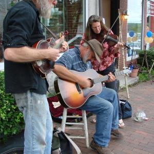 Wiscasset residents Chris Lannon, left, on mandolin, Rick Turcotte on guitar and Liz Lannon on fiddle make music as Turcotte sings a song he wrote. SUSAN JOHNS/Wiscasset Newspaper