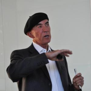 Dr. Ed Bosarge talks to the crowd July 16. Bosarge, who has a residence in Southport, talked at Bigelow Laboratory's Cafe Scientifique about Over Yonder Cay, a renewable energy resort. BEN BULKELEY/Boothbay Register