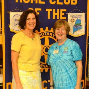 Marty Helman, right, who served as District Governor for Rotary in 2012-13, smiles as she "passes the gavel" to incoming Governor Carolyn Johnson at the Rotary Clubhouse last week. Courtesy of the Boothbay Harbor Rotary Club